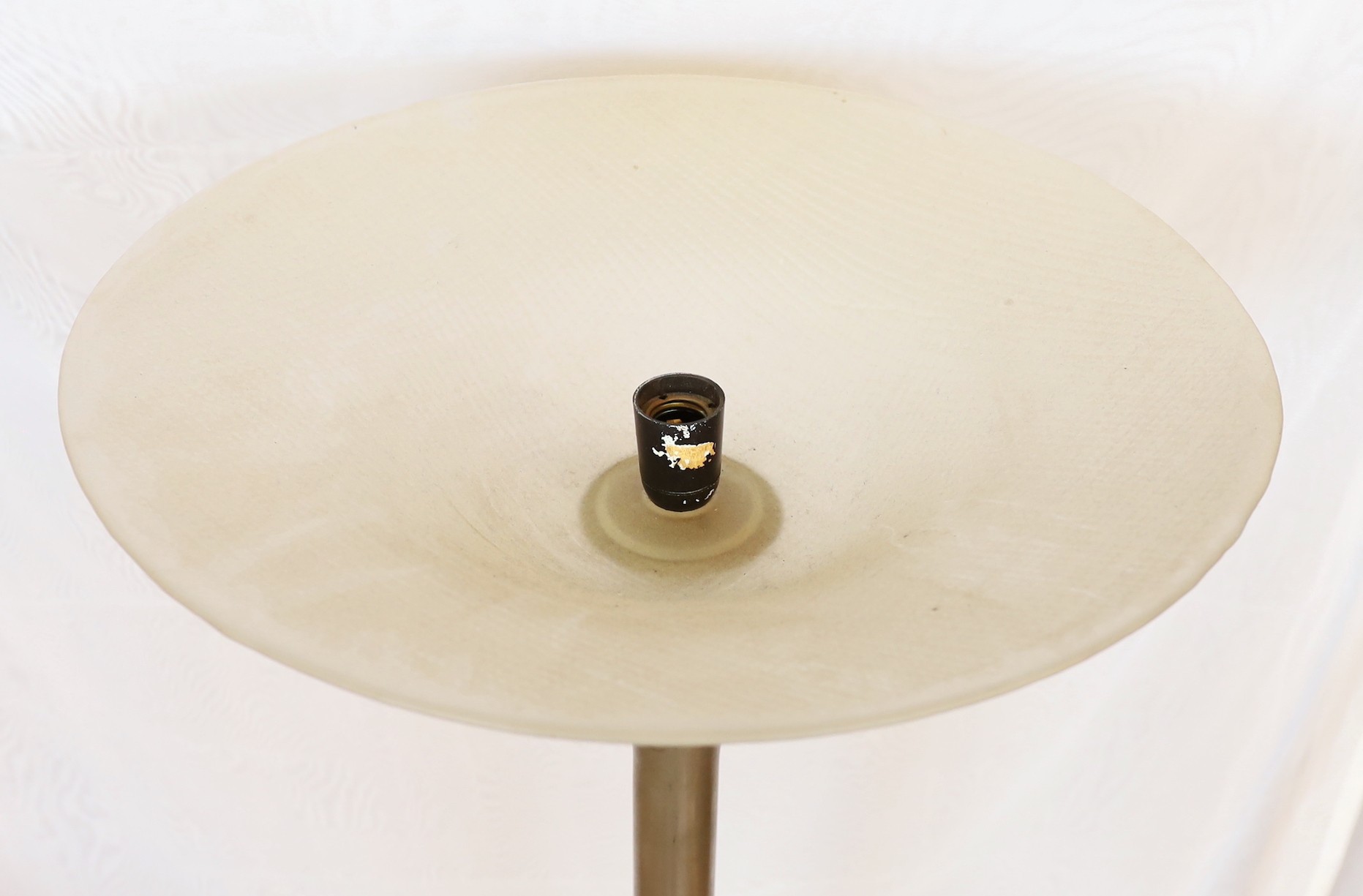 A 1960s steel uplighter lamp standard with ribbed and frosted glass shade, height 171cm. width of base 65cm. width of shade 50cm